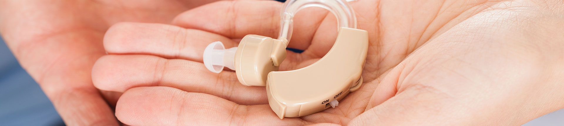 Hand Holding Hearing Aid